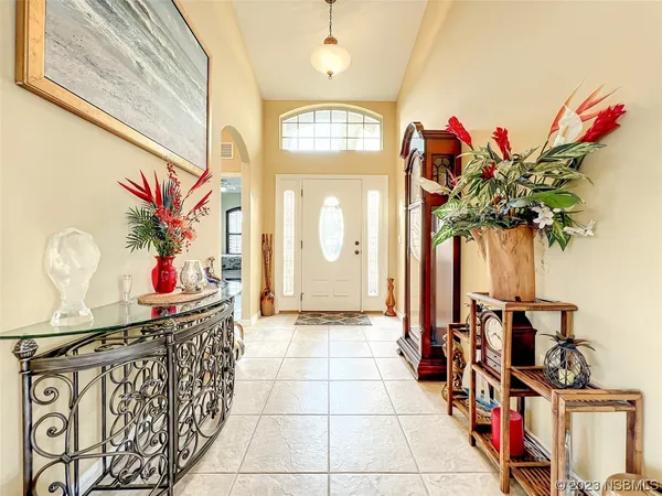 a view of a livingroom with furniture and a kitchen
