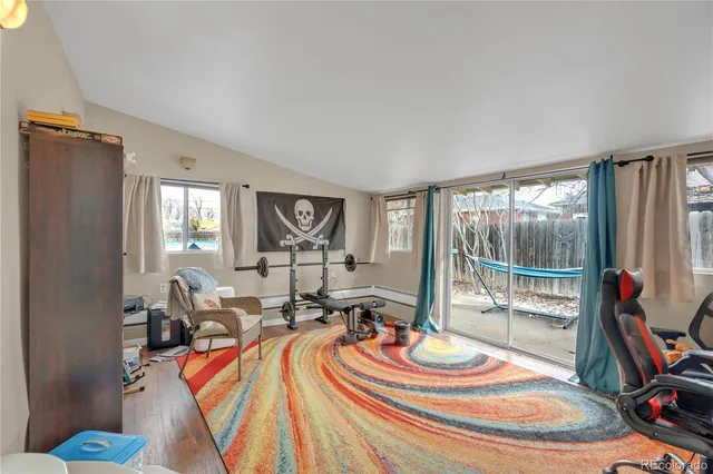 a bedroom with a large bed and a flat screen tv