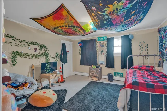 a living room filled with lots of furniture and baby toys