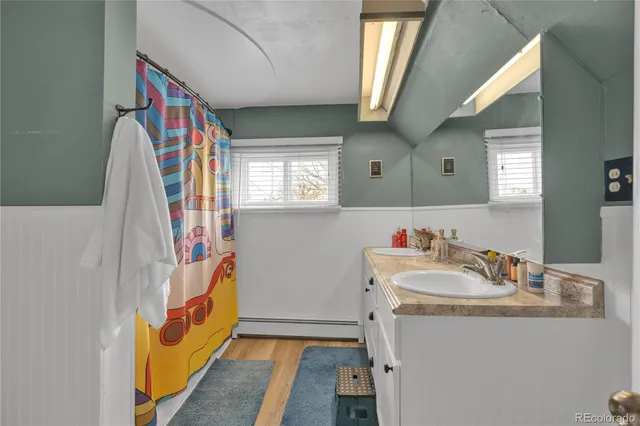 a spacious bedroom with a bed and a window