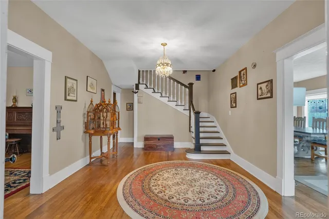 a view of an entryway with wooden floor