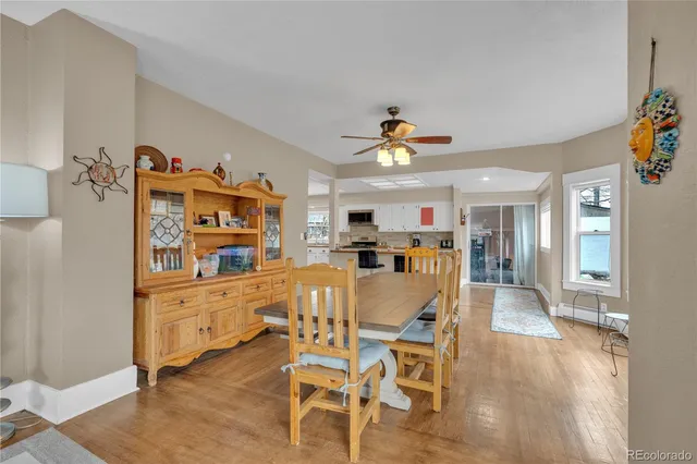 a view of a dining room with furniture and chandelier