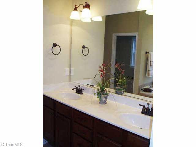 52 The Bluffs Rural Hall, NC 27045 - Photo 6 of 9 Other. The Master Bath with Eloquence. Separate Standup Shower, Elevated Dual Vanities, Jetted Tub and Spacious Walk in Closet.