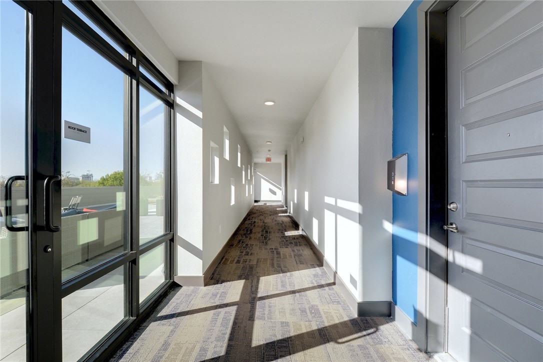 a view of a hallway with windows