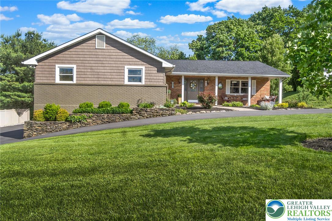 540 Briar Road Pen Argyl, PA 18072 - Photo 1 of 66 A classic ranch home offers a welcoming brick facade and expansive lawn.