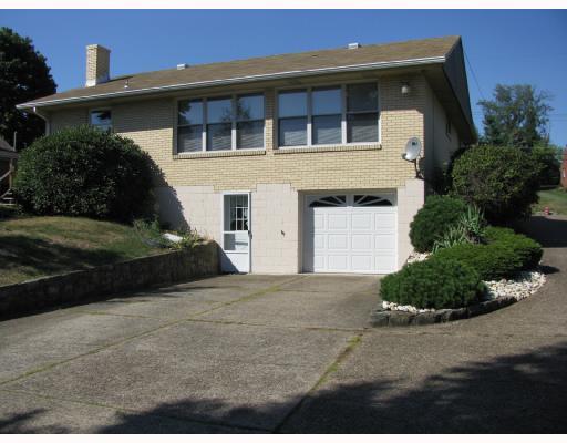 27 Greenview Drive McKees Rocks, PA 15136 - Photo 3 of 13 Exterior Back. Large Drive way, tandem garage, large deck area.