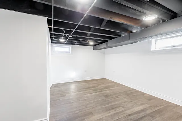 a view of a room with wooden floor