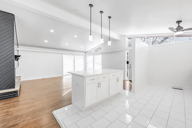 a large kitchen with a lot of counter space and appliances