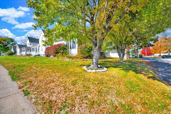 a view of a house with a backyard