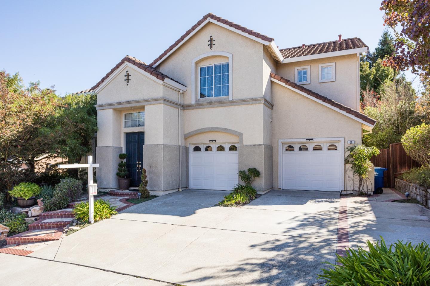 52 Foster Drive San Ramon, CA 94583 - Photo 2 of 50 a front view of a house with a yard and garage