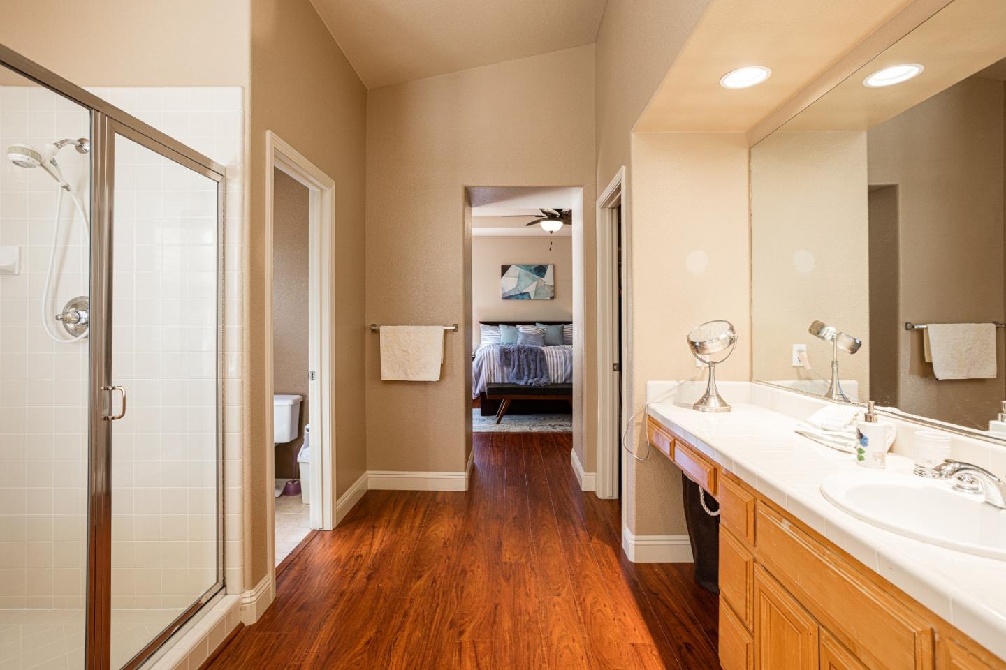 52 Foster Drive San Ramon, CA 94583 - Photo 27 of 50 a view of a bathroom with a tub sink and mirror