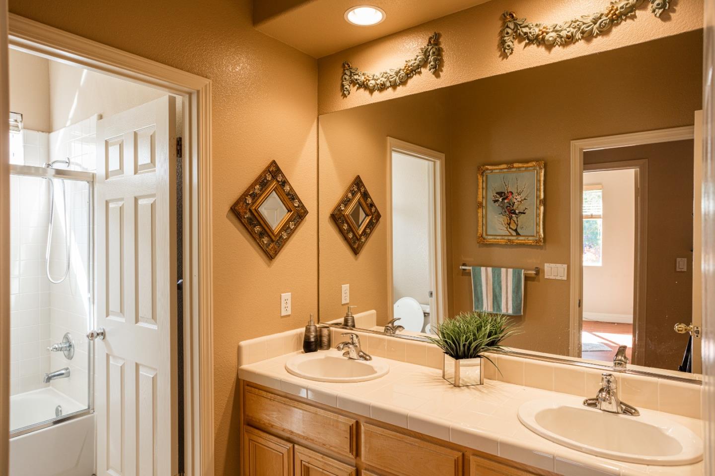 52 Foster Drive San Ramon, CA 94583 - Photo 32 of 50 a bathroom with a double vanity sink and a mirror