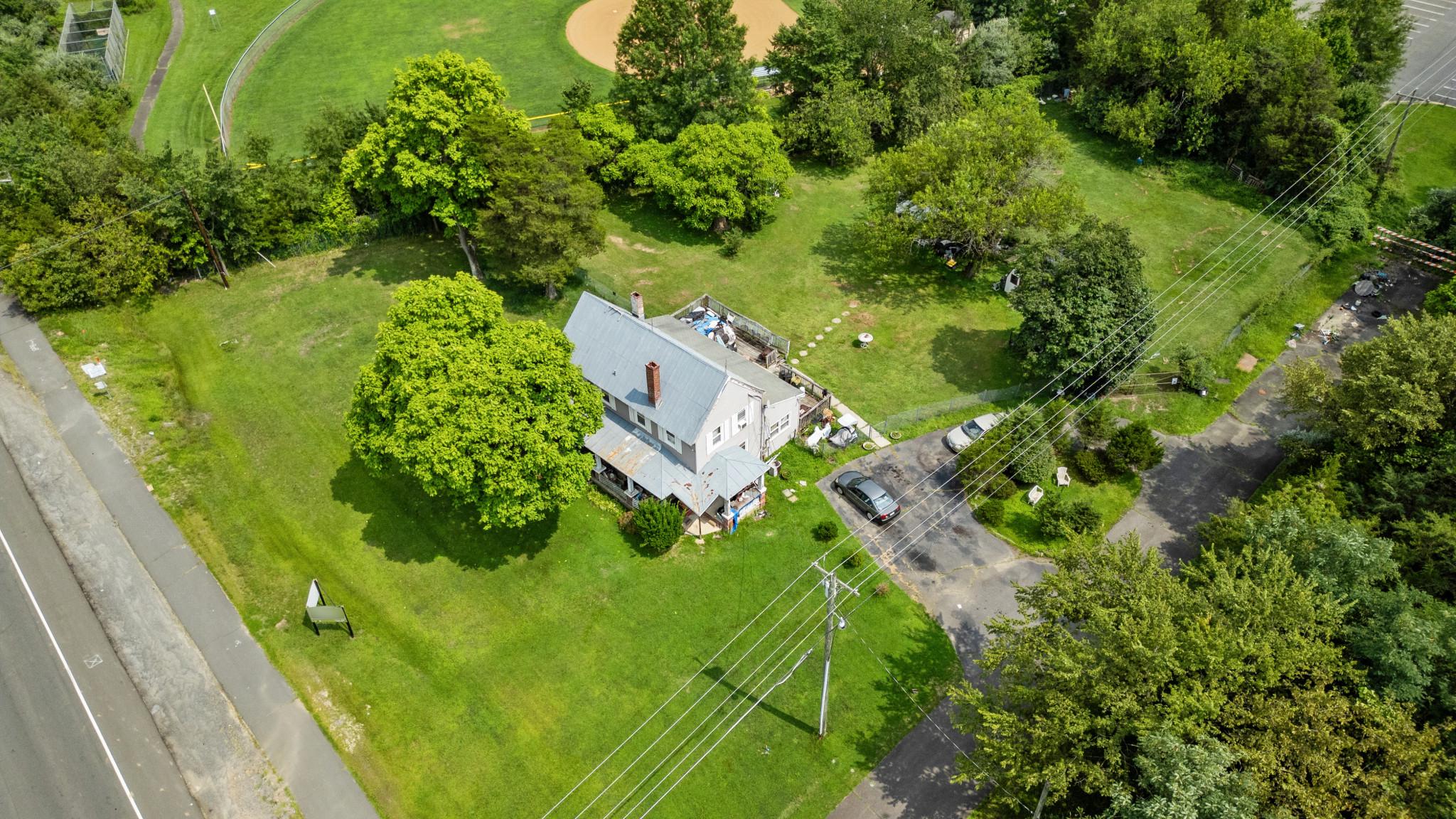 12115 Braddock Road Fairfax, VA 22030 - Photo 2 of 16 Charming location amidst lush greenery.