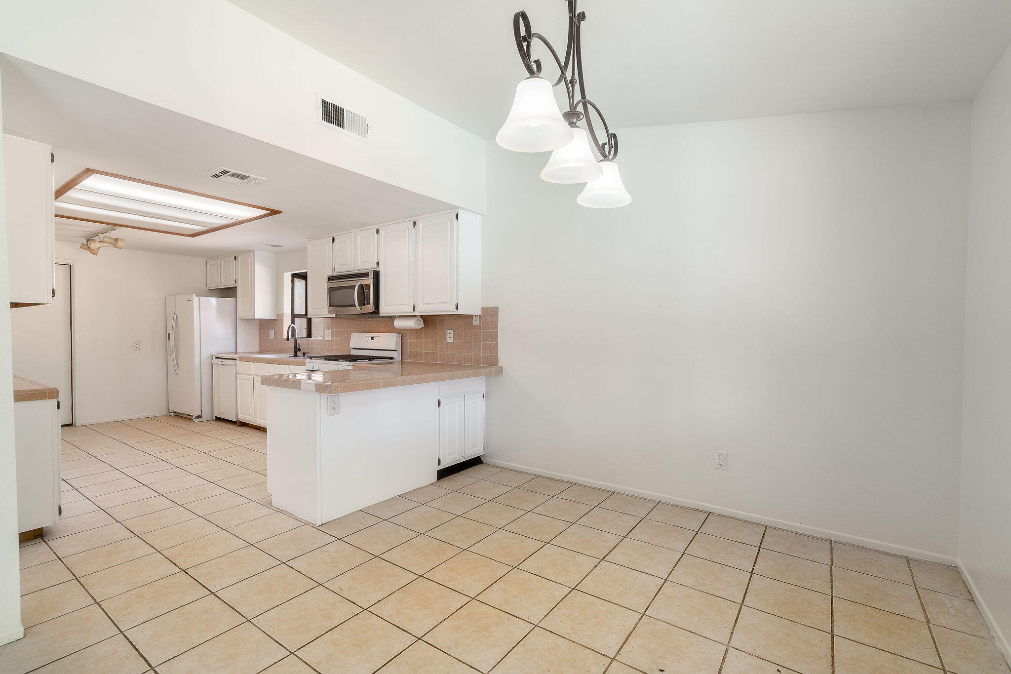 68750 Fortuna Road Cathedral City, CA 92234 - Photo 14 of 42 a view of kitchen with granite countertop cabinets and refrigerator
