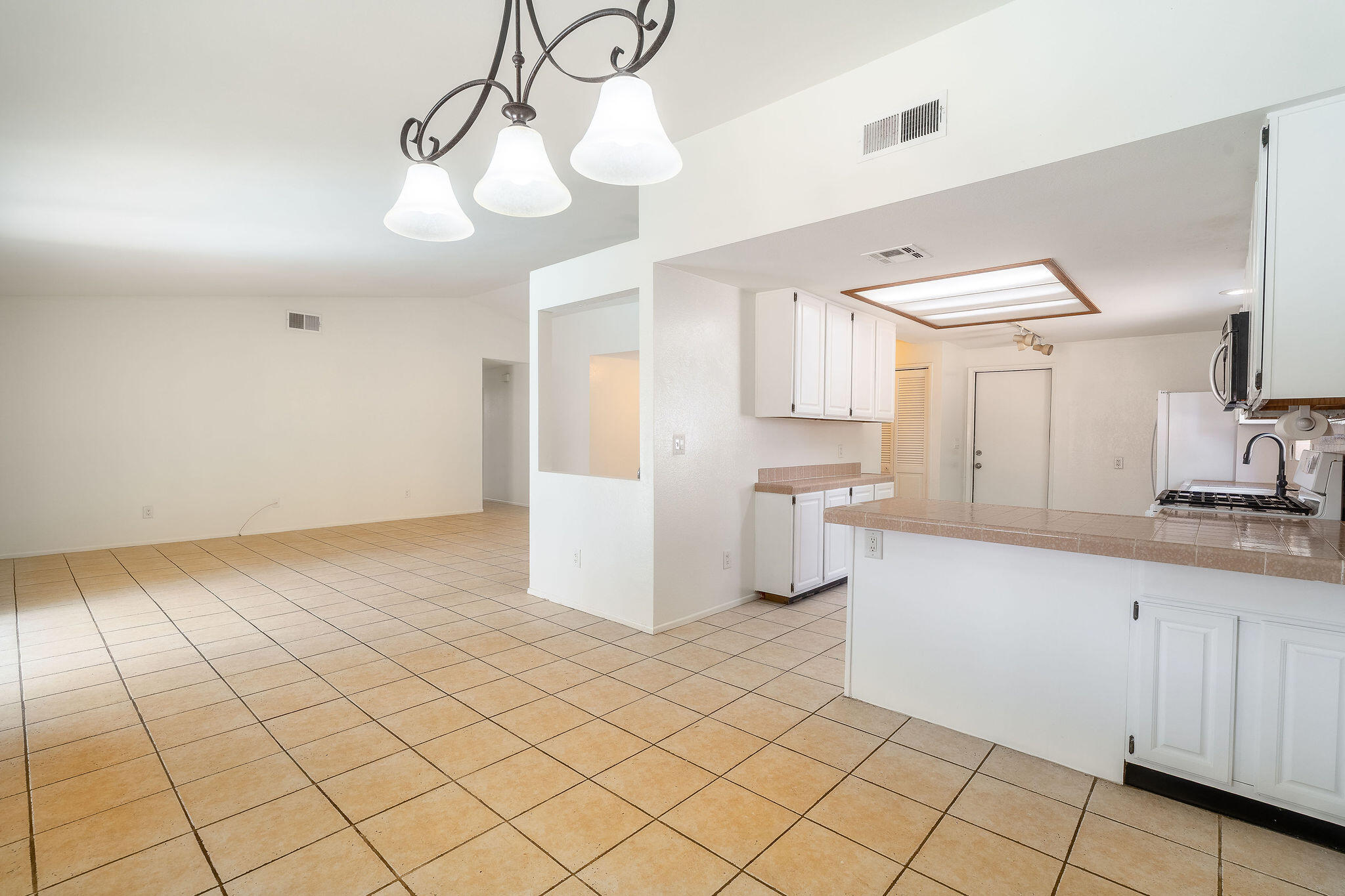 68750 Fortuna Road Cathedral City, CA 92234 - Photo 15 of 42 a kitchen with a sink cabinets and window