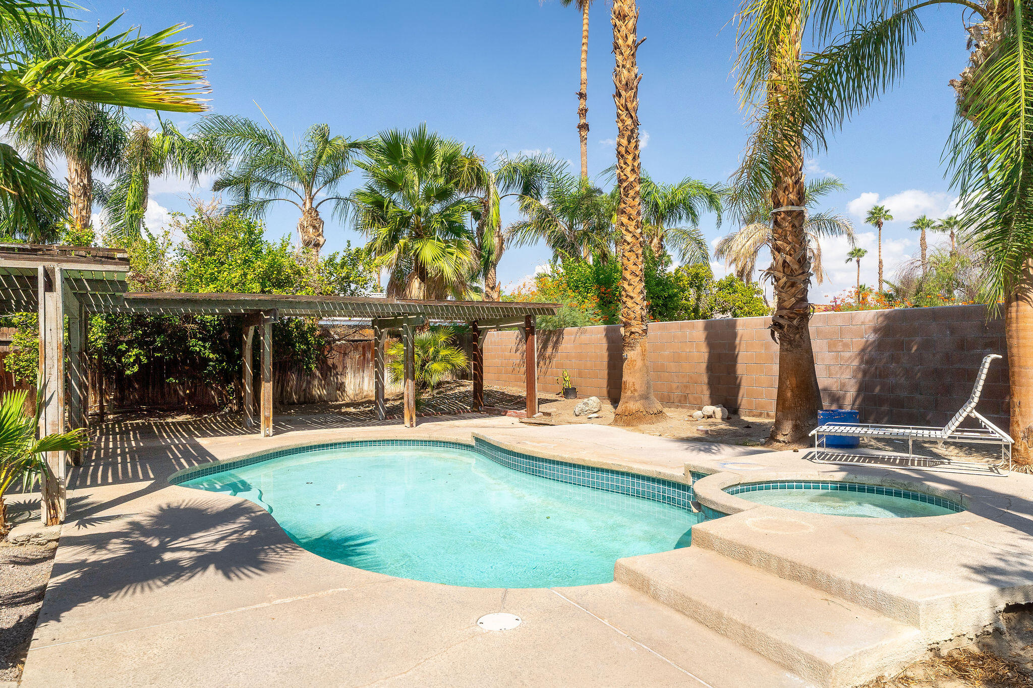 68750 Fortuna Road Cathedral City, CA 92234 - Photo 2 of 42 a view of a backyard with palm trees