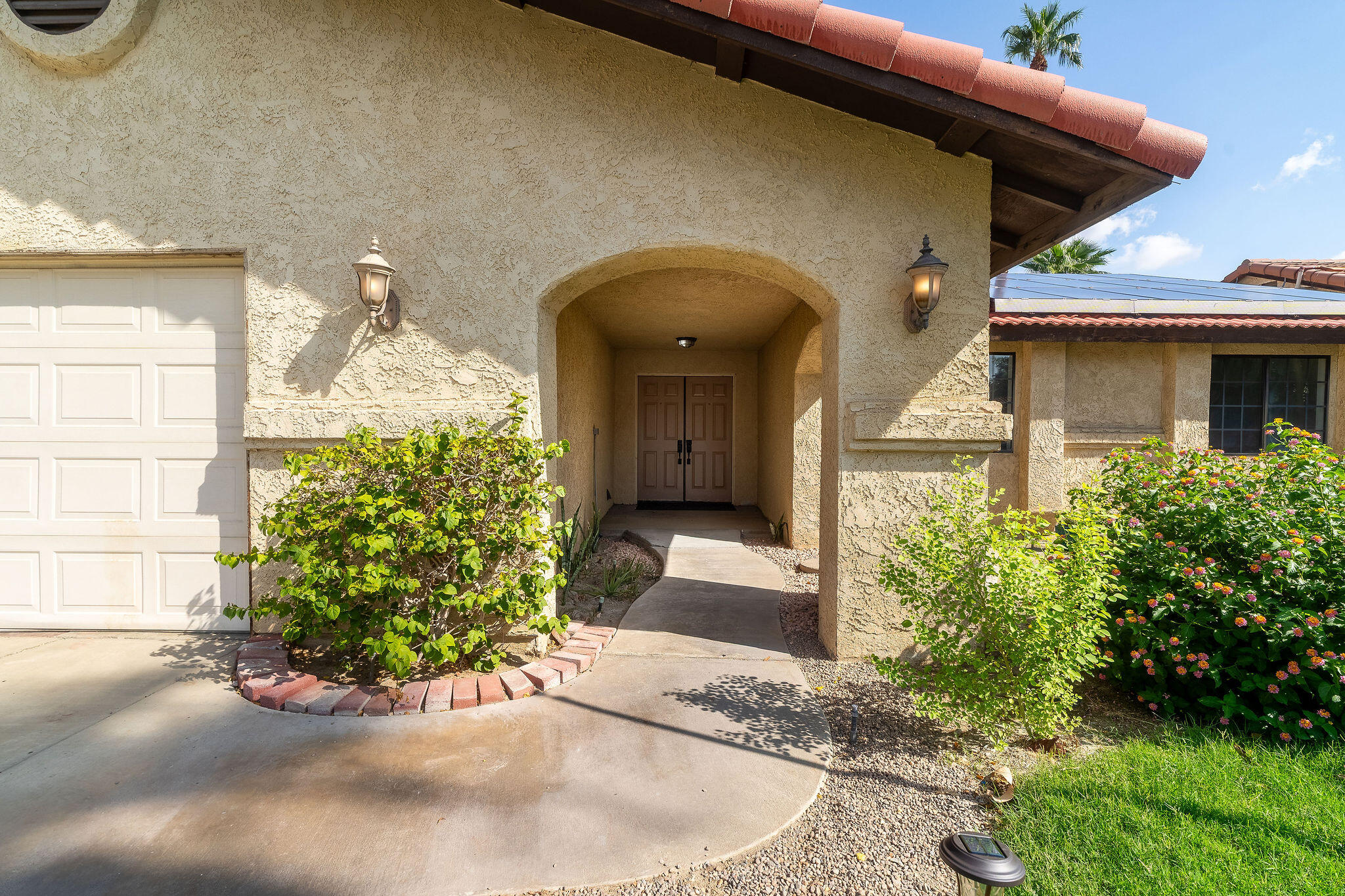 68750 Fortuna Road Cathedral City, CA 92234 - Photo 6 of 42 a front view of a house with garden