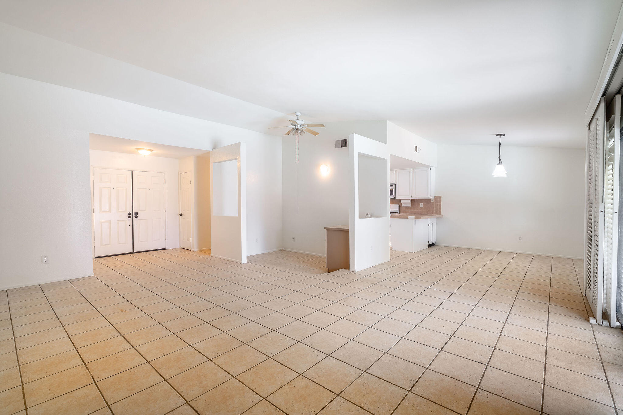 68750 Fortuna Road Cathedral City, CA 92234 - Photo 10 of 42 a view of a kitchen with white cabinets