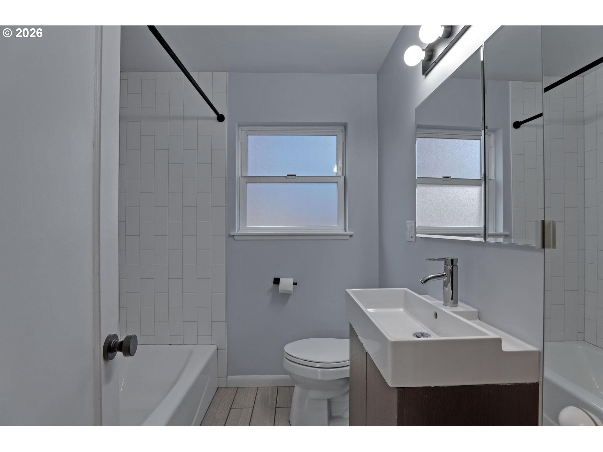 8915 Southeast Market Street Portland, OR 97216 - Photo 11 of 26 a bathroom with a sink toilet a mirror and shower