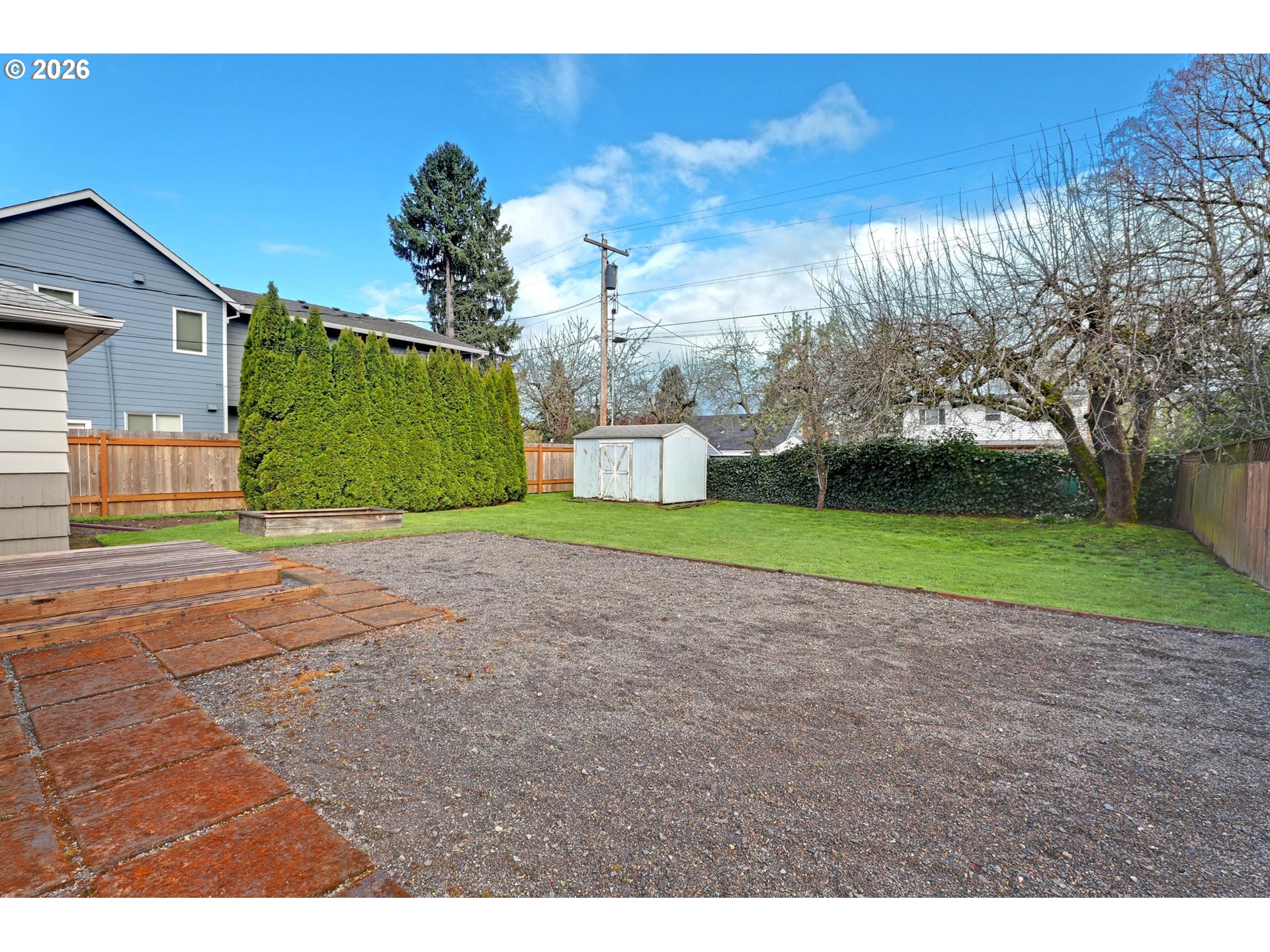 8915 Southeast Market Street Portland, OR 97216 - Photo 16 of 26 a view of a house with a backyard