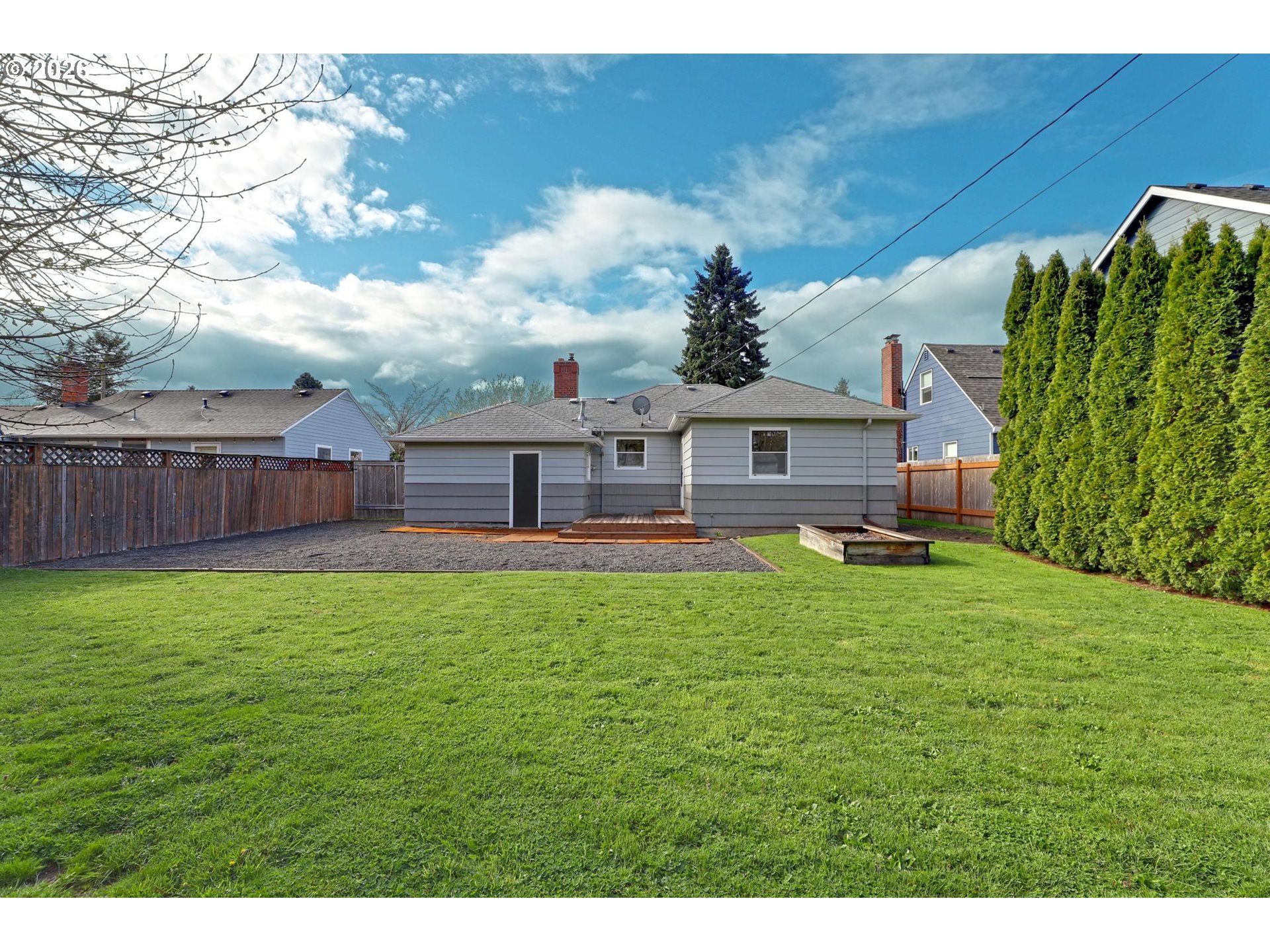 8915 Southeast Market Street Portland, OR 97216 - Photo 18 of 26 a view of a backyard with a garden