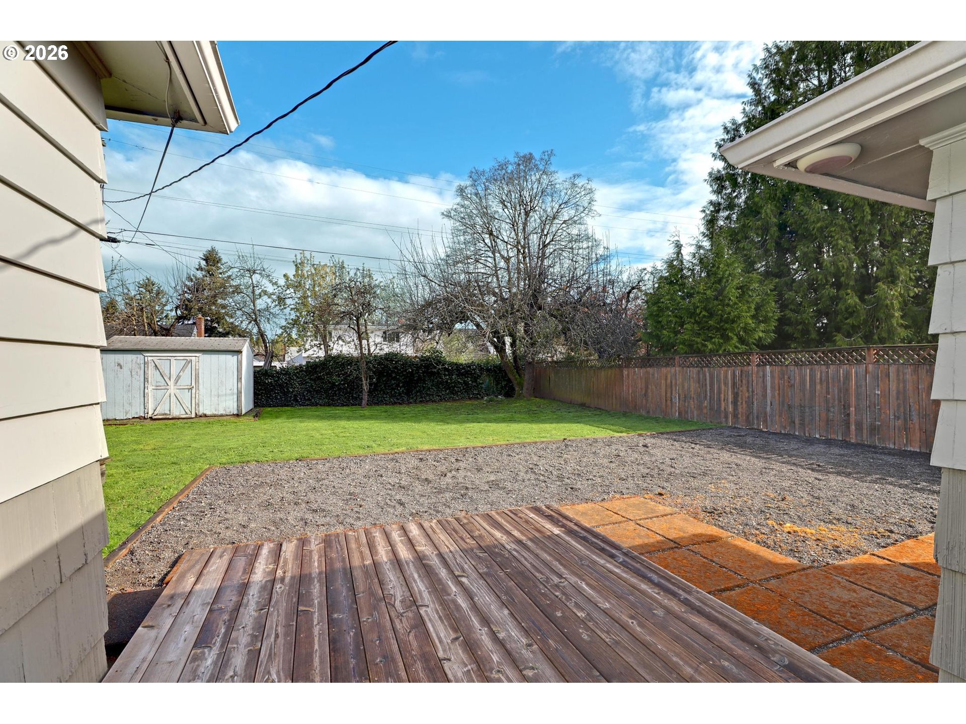 8915 Southeast Market Street Portland, OR 97216 - Photo 19 of 26 a view of backyard with wooden fence