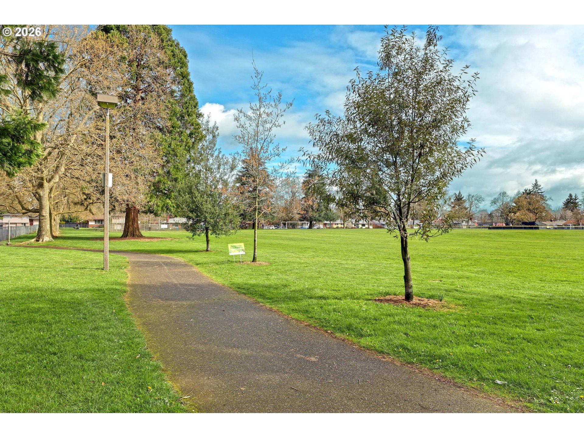 8915 Southeast Market Street Portland, OR 97216 - Photo 22 of 26 a view of a park with large trees