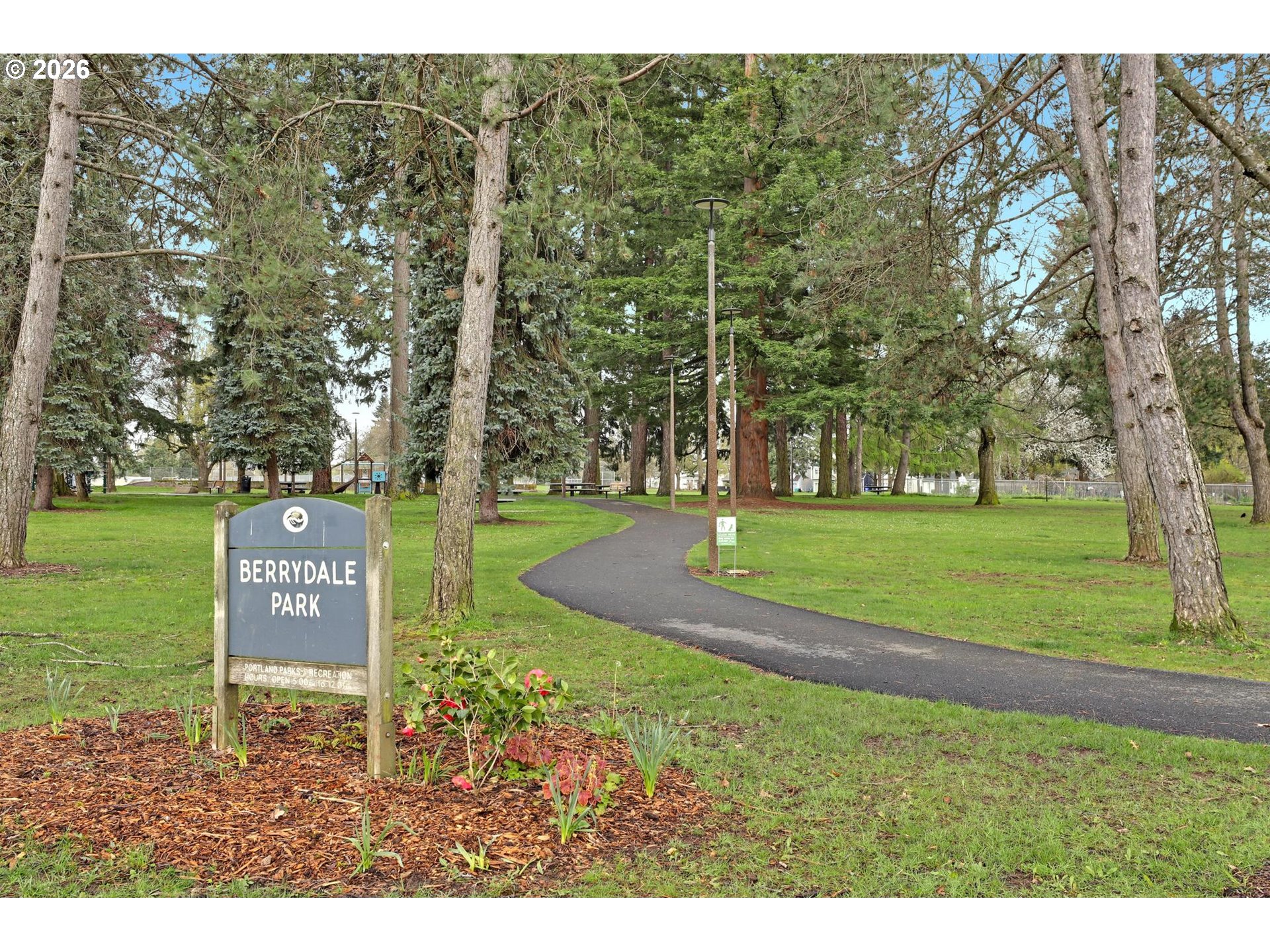 8915 Southeast Market Street Portland, OR 97216 - Photo 23 of 26 a view of a park with welcome board