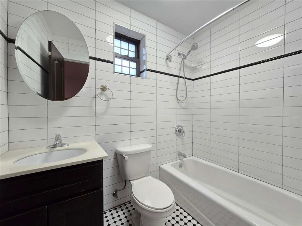 151 Noll Street Brooklyn, NY 11206 - Photo 30 of 30 a bathroom with a sink toilet and shower