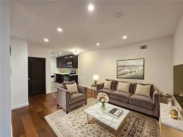 a living room with furniture and a rug