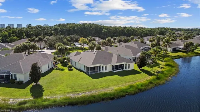 an aerial view of residential houses with outdoor space and street view