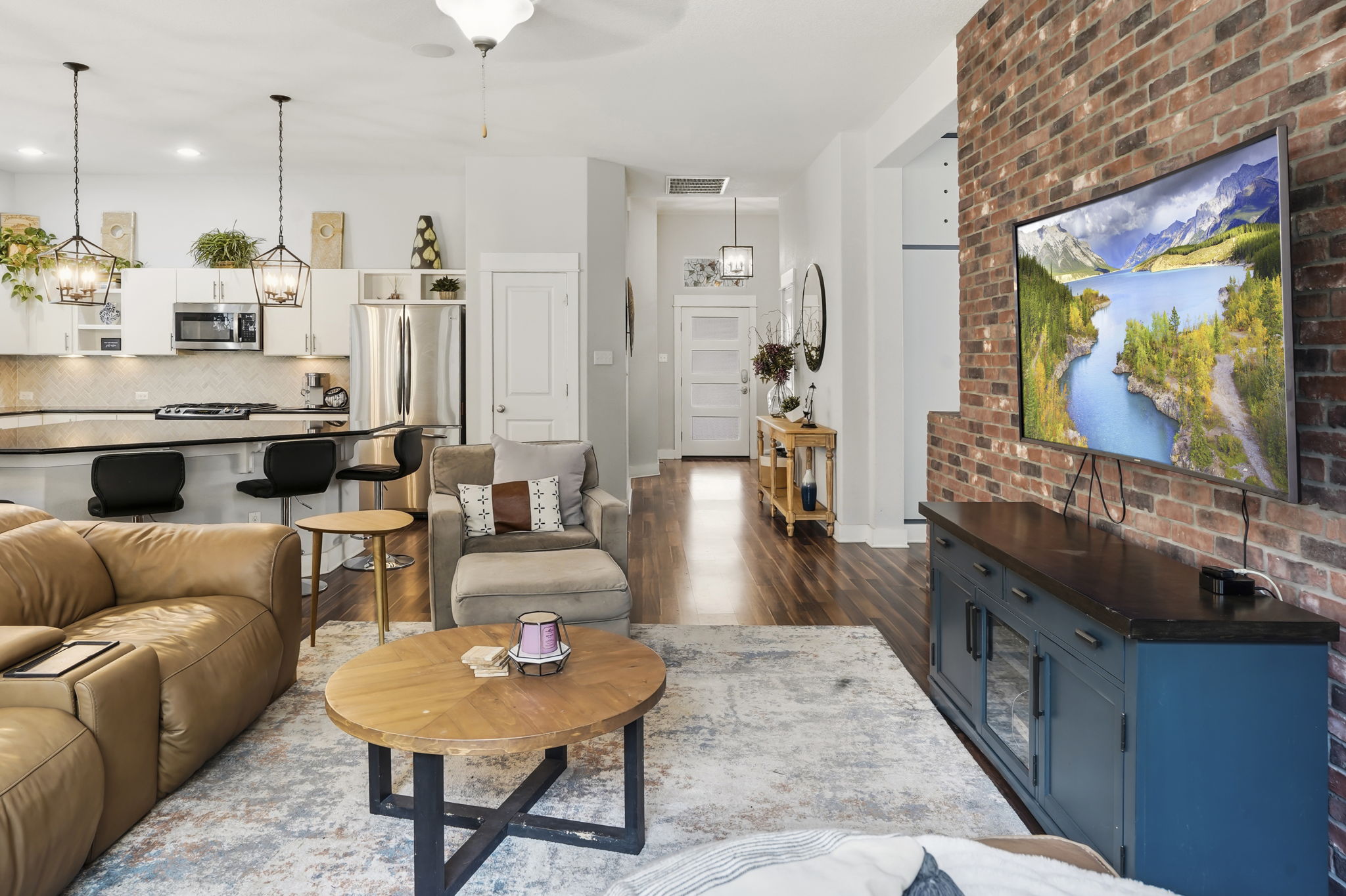 504 Bowery Trail Austin, TX 78753 - Photo 11 of 38 Living area with dark wood finished floors, a ceiling fan, and suspended lighting