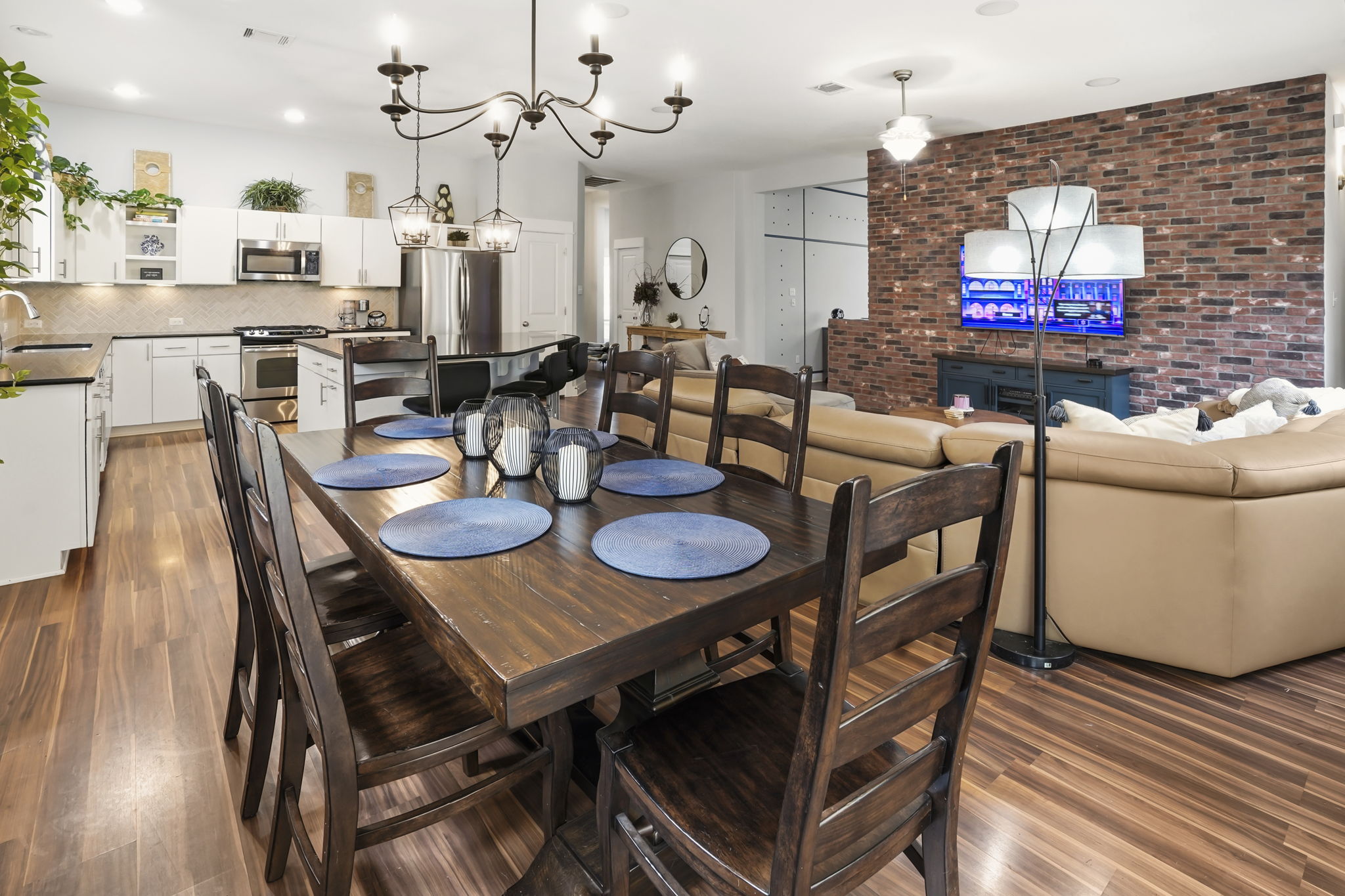 504 Bowery Trail Austin, TX 78753 - Photo 18 of 38 Dining room with brick wall, dark wood finished floors, and recessed lighting