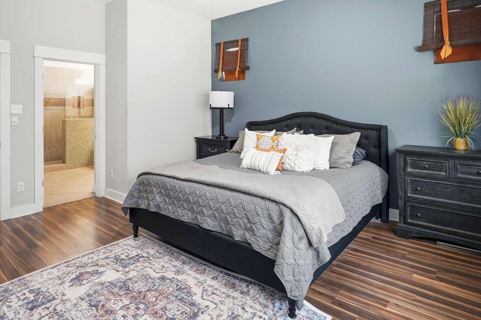 504 Bowery Trail Austin, TX 78753 - Photo 20 of 38 Bedroom with dark wood-style floors and ensuite bath