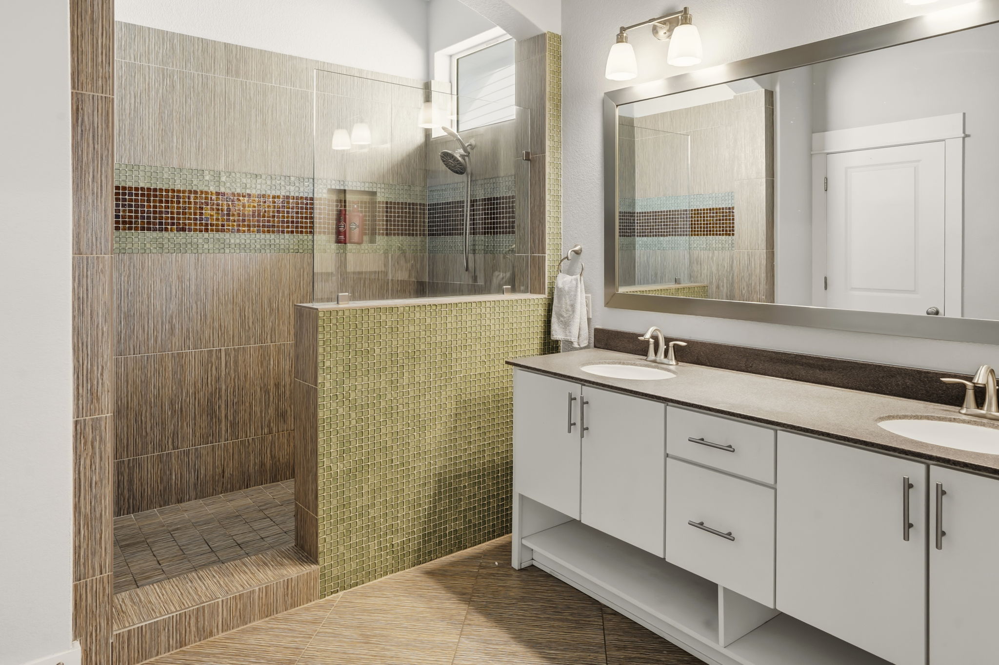 504 Bowery Trail Austin, TX 78753 - Photo 21 of 38 Full bath featuring double vanity, walk in shower, and light tile patterned floors