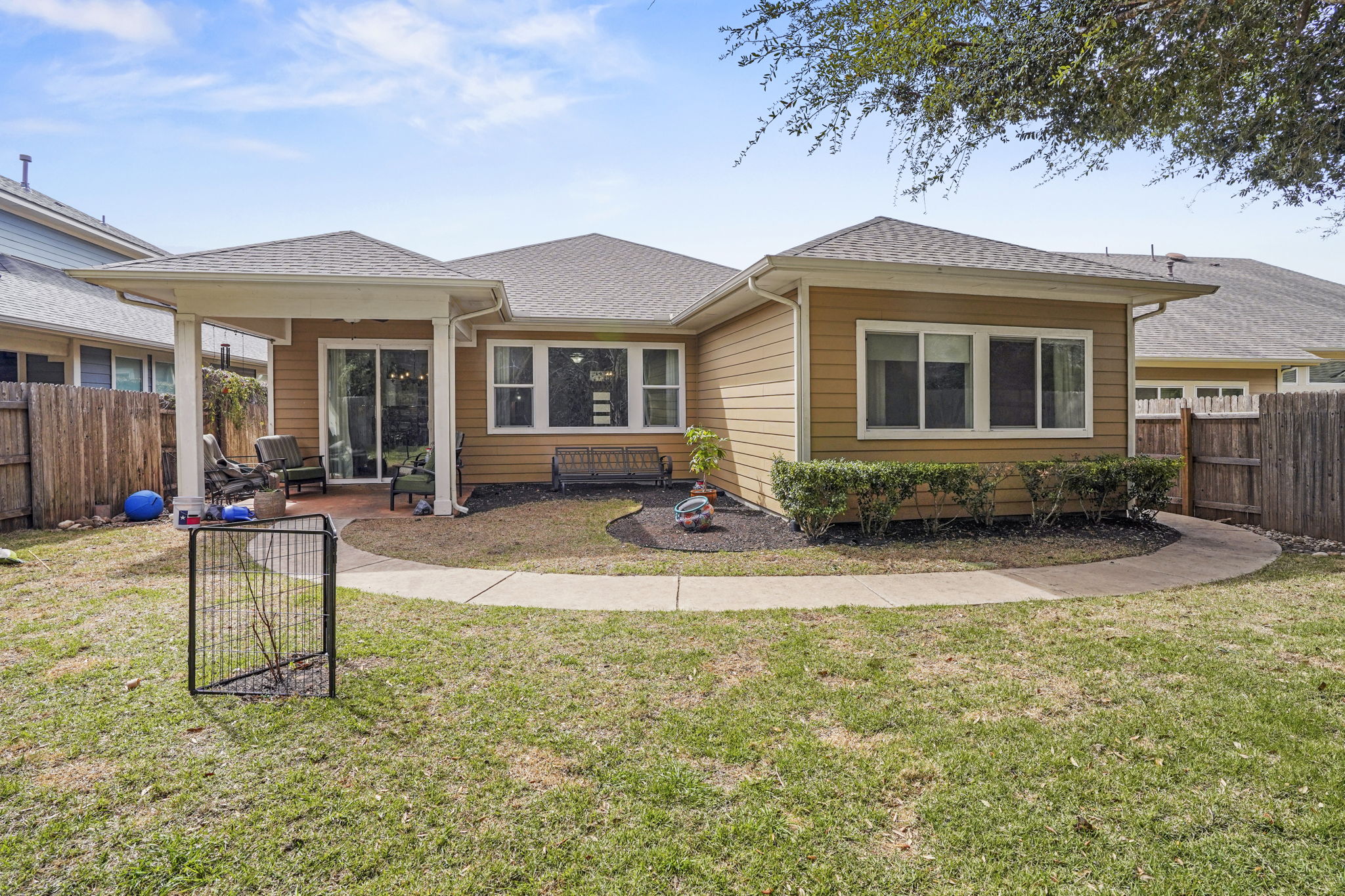 504 Bowery Trail Austin, TX 78753 - Photo 30 of 38 Back of property with roof with shingles and a patio