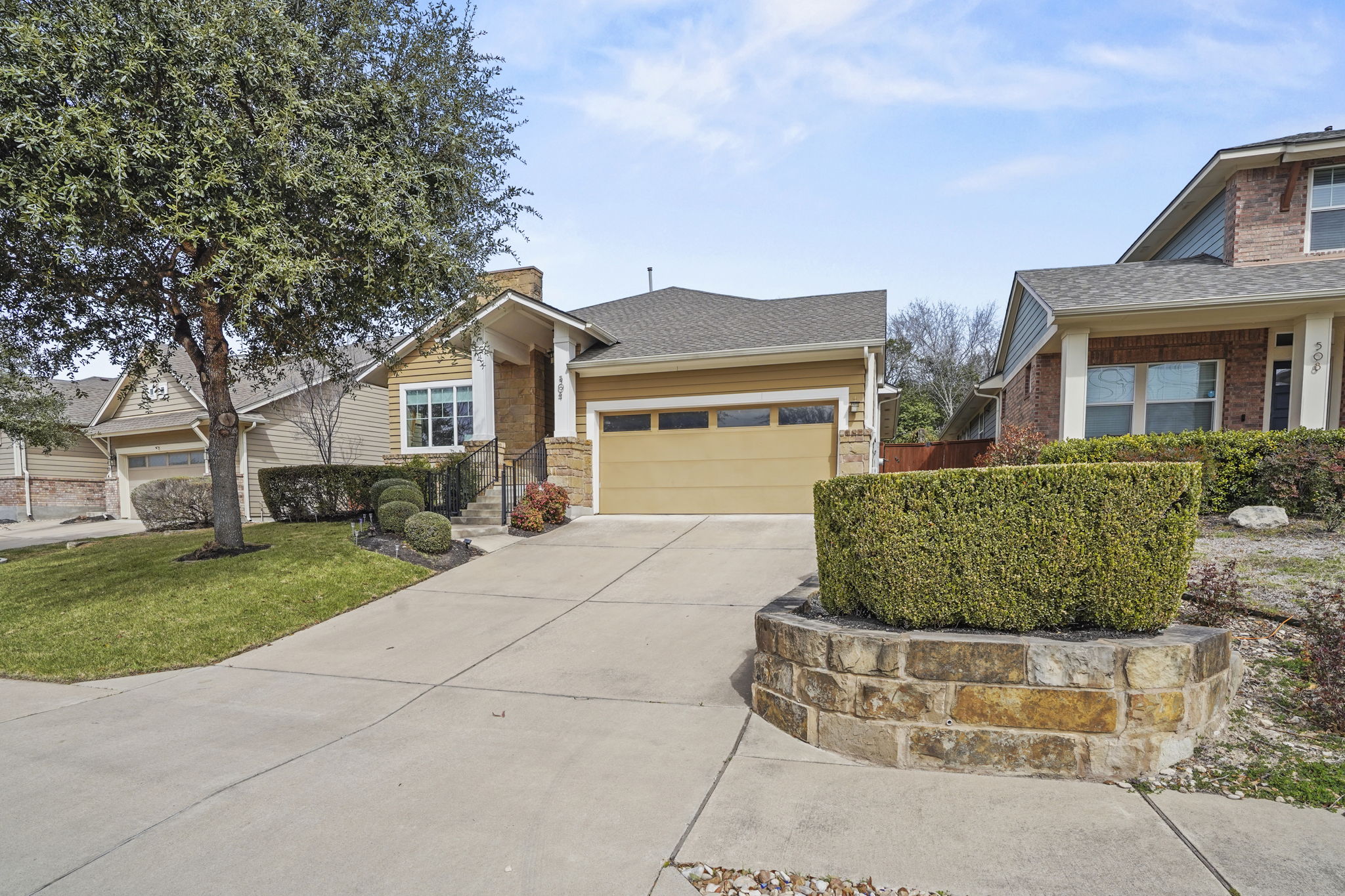 504 Bowery Trail Austin, TX 78753 - Photo 3 of 38 Craftsman-style house featuring an attached garage, driveway, roof with shingles, and a front yard
