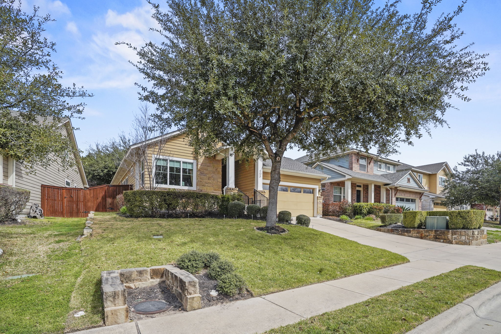 504 Bowery Trail Austin, TX 78753 - Photo 35 of 38 Craftsman-style house with an attached garage and driveway