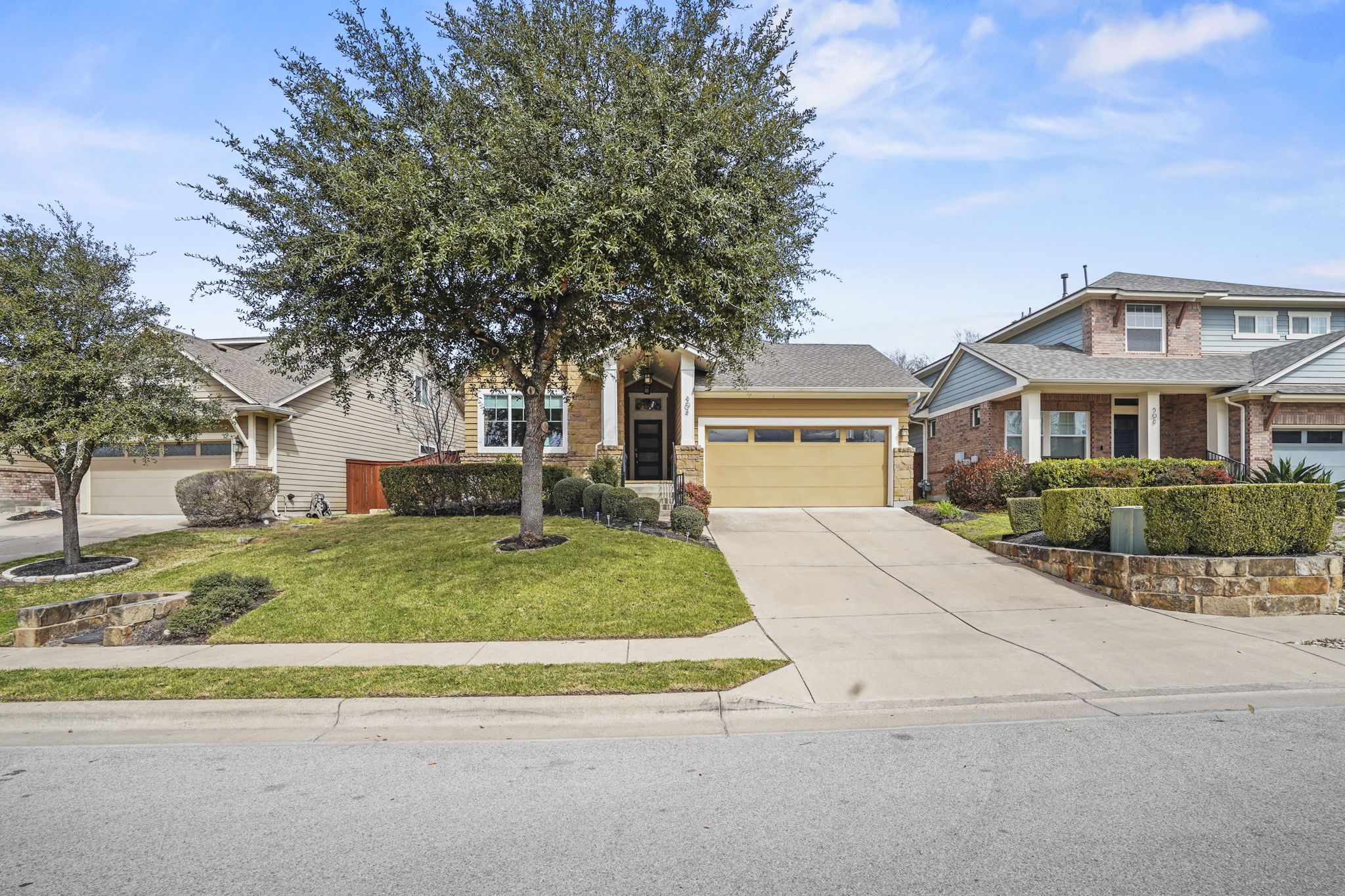 504 Bowery Trail Austin, TX 78753 - Photo 4 of 38 Craftsman-style home featuring concrete driveway, a garage, and a front yard