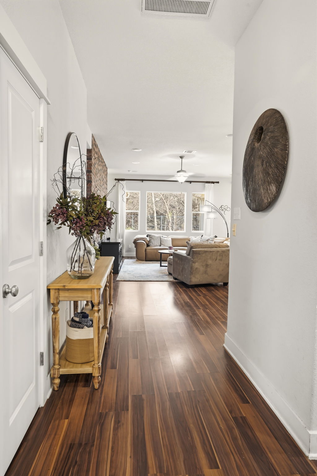 504 Bowery Trail Austin, TX 78753 - Photo 6 of 38 Hall with dark wood-style floors and baseboards