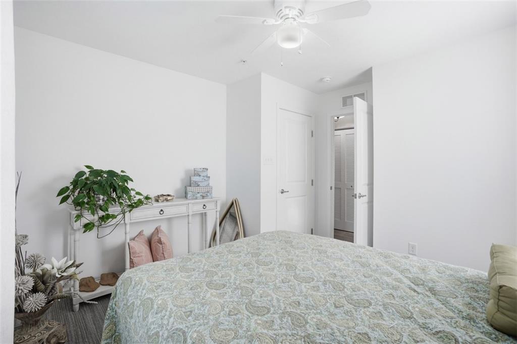 3101 Pointe View Drive Mars, PA 16046 - Photo 27 of 41 a bedroom with a bed and a potted plant