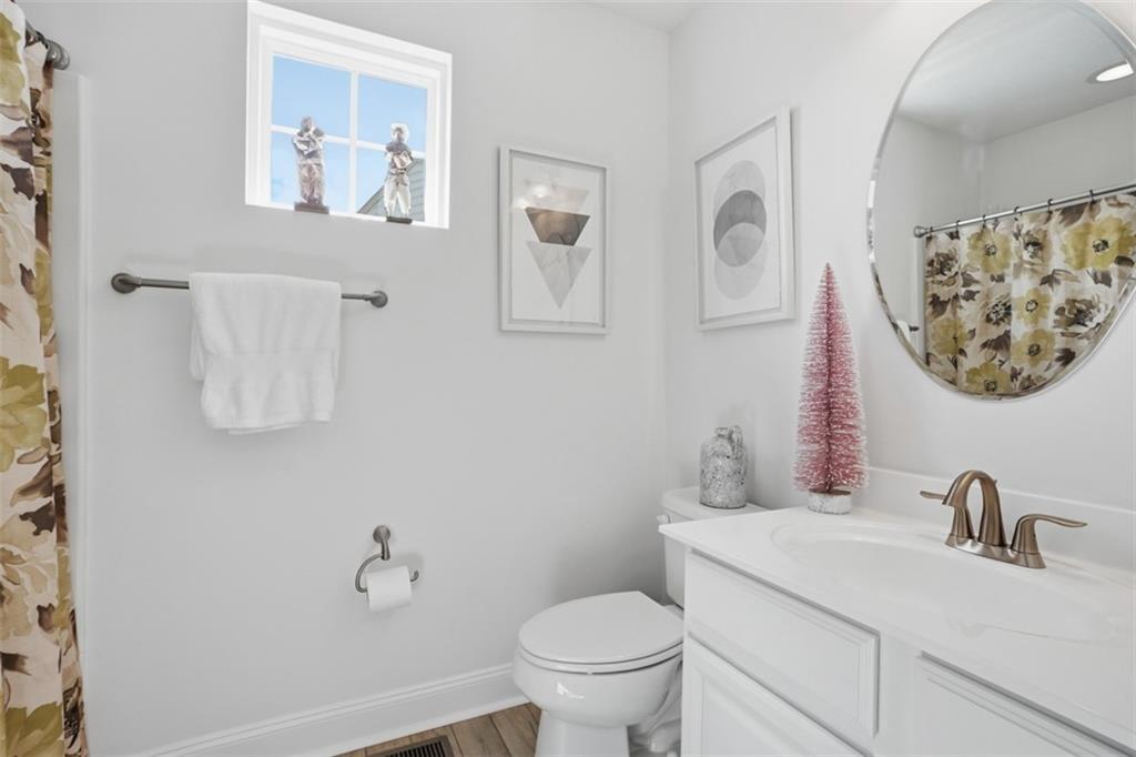 3101 Pointe View Drive Mars, PA 16046 - Photo 28 of 41 a bathroom with a toilet sink and mirror