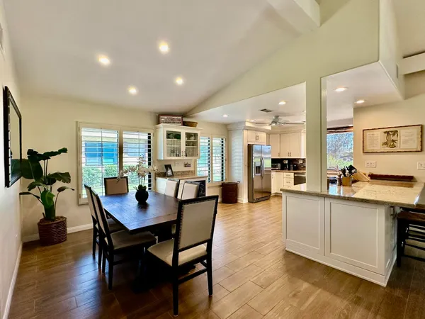a view of a dining area with furniture and wooden floor