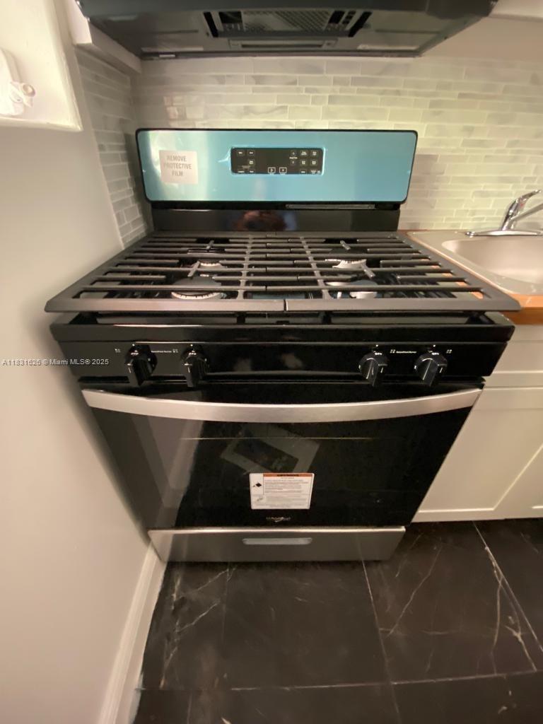 1227 Euclid Avenue, Unit 6 Miami Beach, FL 33139 - Photo 14 of 24 a close view of stove top oven