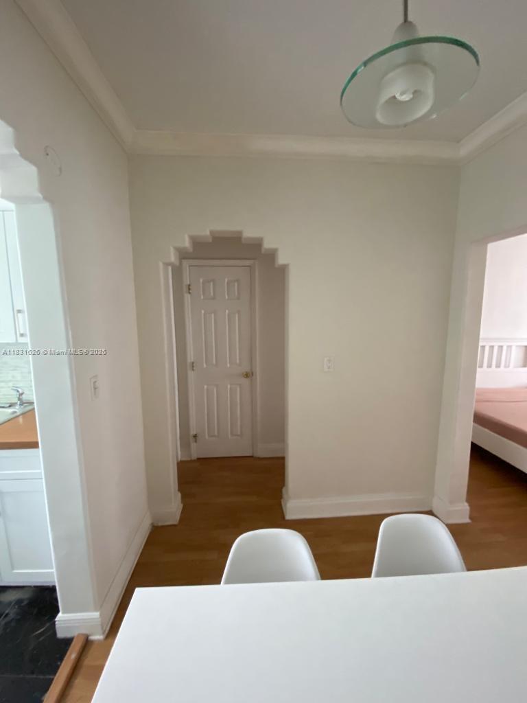 1227 Euclid Avenue, Unit 6 Miami Beach, FL 33139 - Photo 17 of 24 a living room with furniture and a window