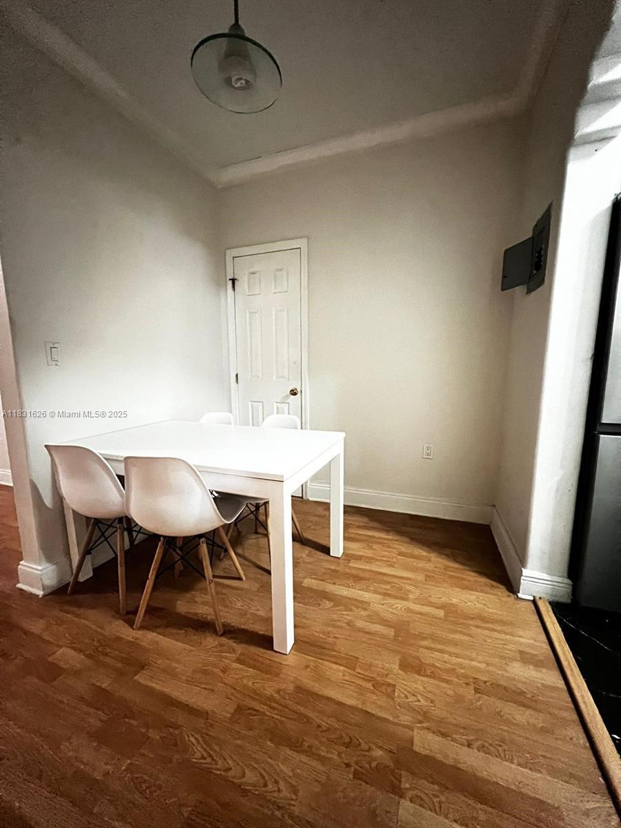 1227 Euclid Avenue, Unit 6 Miami Beach, FL 33139 - Photo 4 of 24 a view of a dining room with furniture and wooden floor