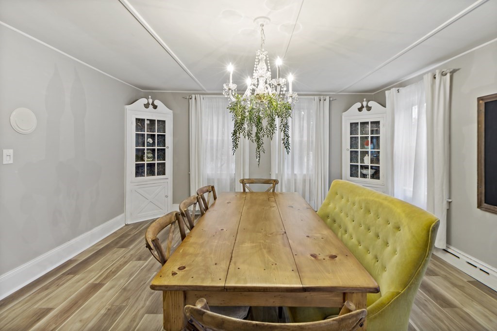 978 Point Road Marion, MA 02738 - Photo 13 of 38 a dining room with a table and chairs