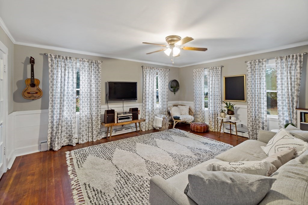 978 Point Road Marion, MA 02738 - Photo 15 of 38 a bedroom with a bed and a flat tv screen on the dresser