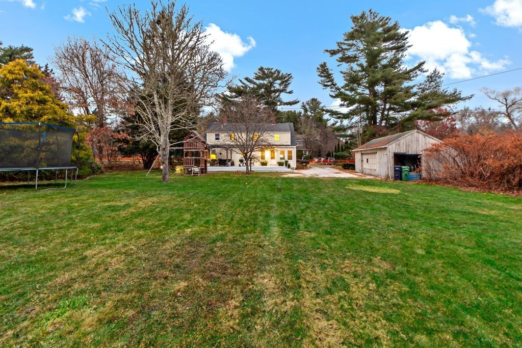 978 Point Road Marion, MA 02738 - Photo 5 of 38 a view of a house with a big yard and large trees