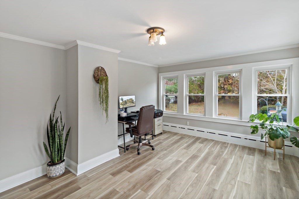 978 Point Road Marion, MA 02738 - Photo 8 of 38 a view of a workspace with furniture and a window